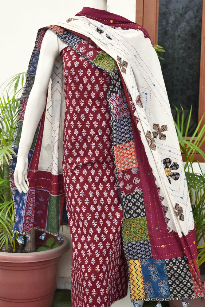 Beautiful Ajrakh Cotton Unstitched Suit with Heavy Applique, Mirror, Kantha & Patch Work dupatta with Tassels